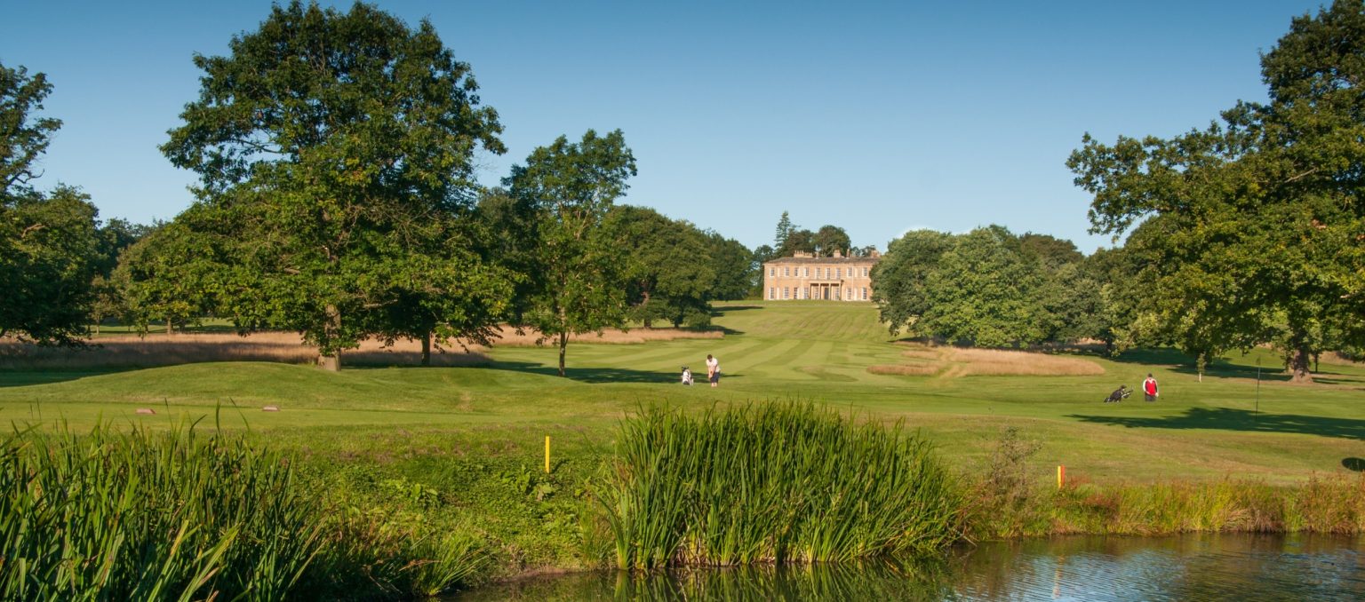 Rudding Park — Stay · Play · Recover | Yorkshire’s Premier Golf & Spa Resort Rudding Park Hawtree Course in Yorkshire with fairway, water and Rudding House
