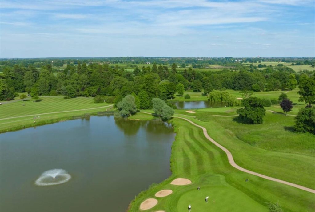 The Warwickshire Golf and Country Club course with water, bunkers and parkland fairways